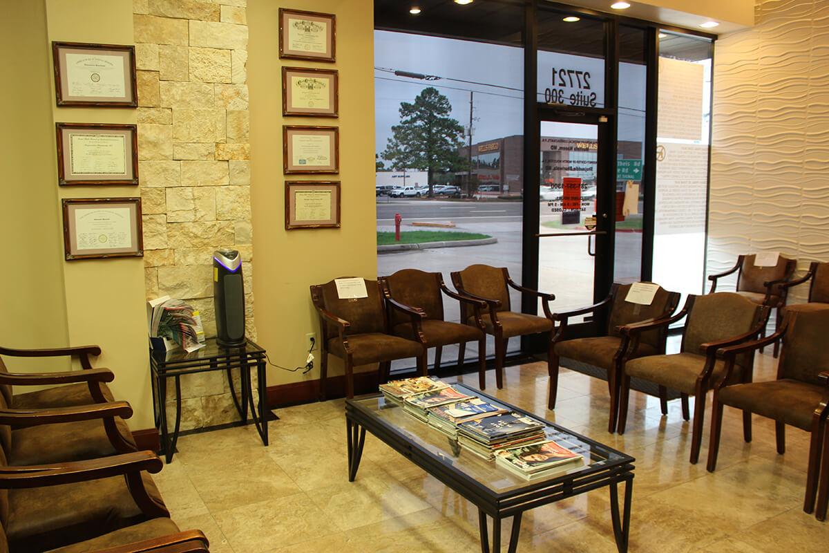 Patient waiting room with seating and posted board certifications
