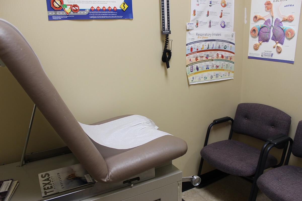 Exam room with patient education materials on pulmonary and respiratory conditions